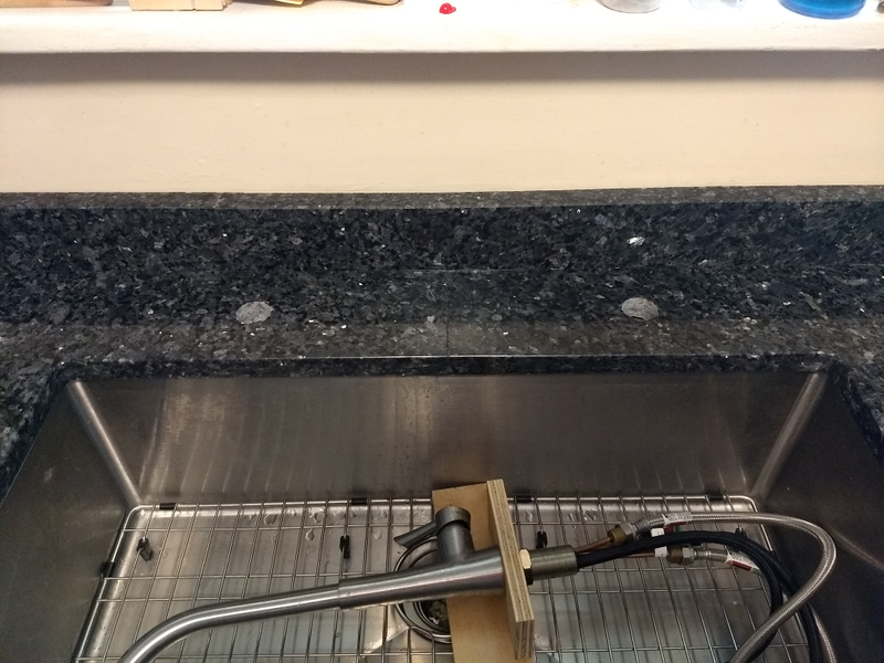 Yes, the faucet hole is off center, as requested.